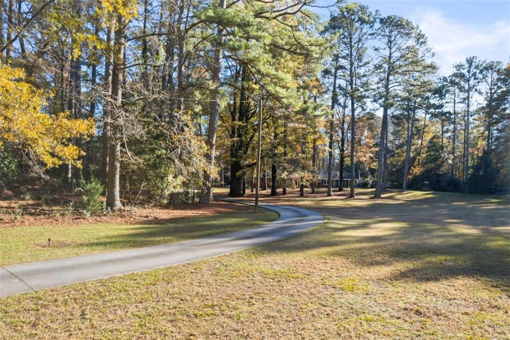 200 McGuirts Bridge Road Covington, GA 30014 - Photo 10 of 100 a view of a swimming pool with an outdoor space