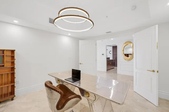 a view of entryway with workspace and a mirror