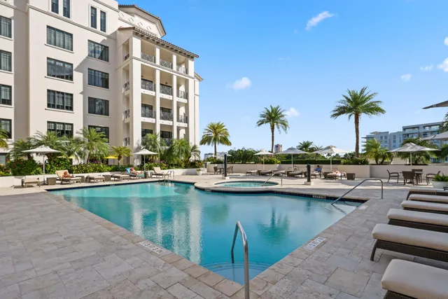 a view of swimming pool with outdoor seating