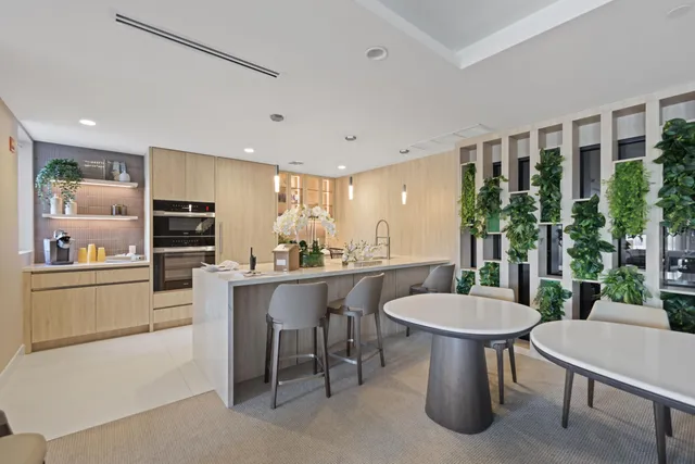 a kitchen with a table and chairs in it