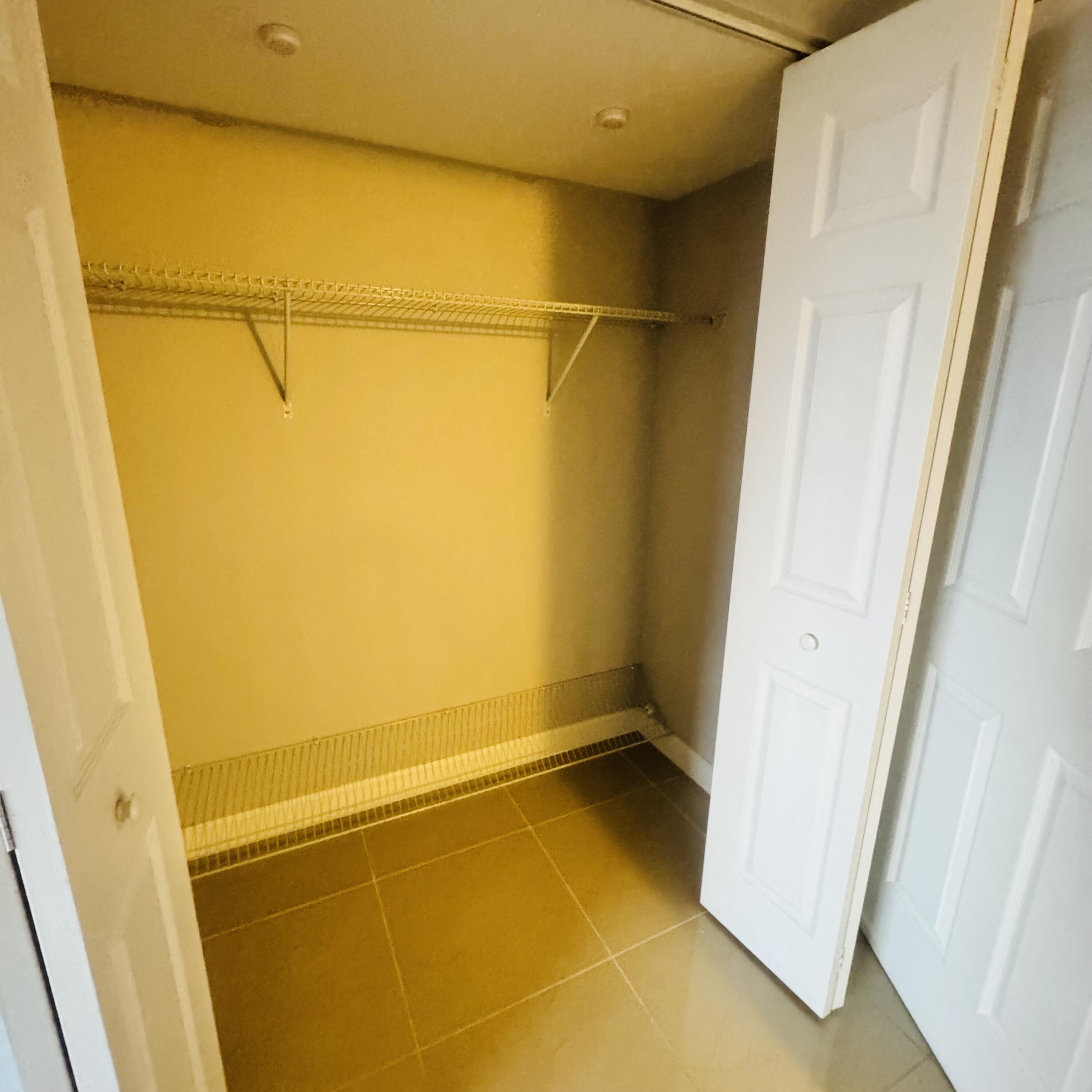 9235 Southwest 8th Street, Unit 503 Boca Raton, FL 33428 - Photo 12 of 17 a view of a room with painted walls