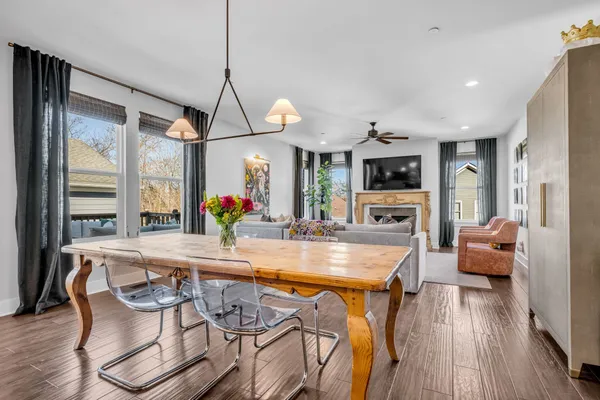 a dining room with furniture and wooden floor