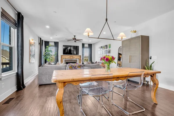 a dining table seating room with furniture and wooden floor