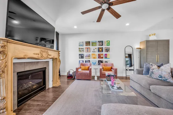 a living room with furniture and a fireplace