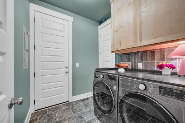 a utility room with dryer and washer