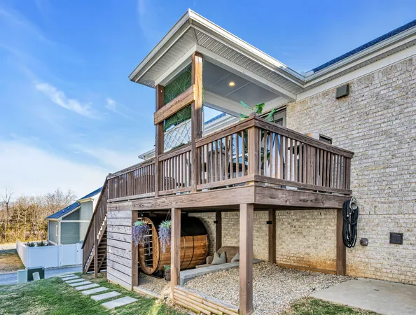 a view of a house with a balcony and stairs