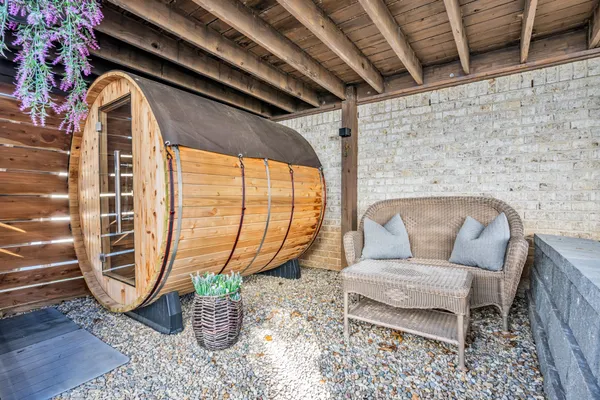a living room with furniture and a floor to ceiling window