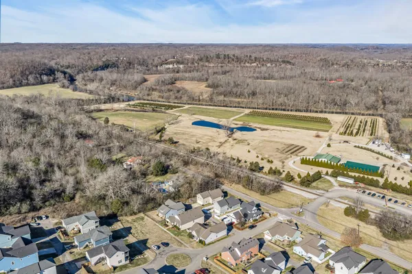 an aerial view of a house with a lake view