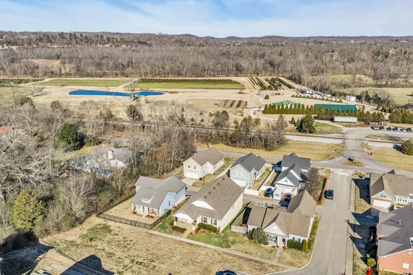 an aerial view of a house with a lake view