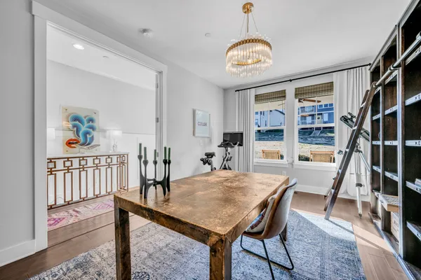 a view of a dining room with furniture window and wooden floor
