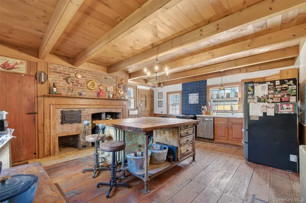 a dining room with a table and chairs