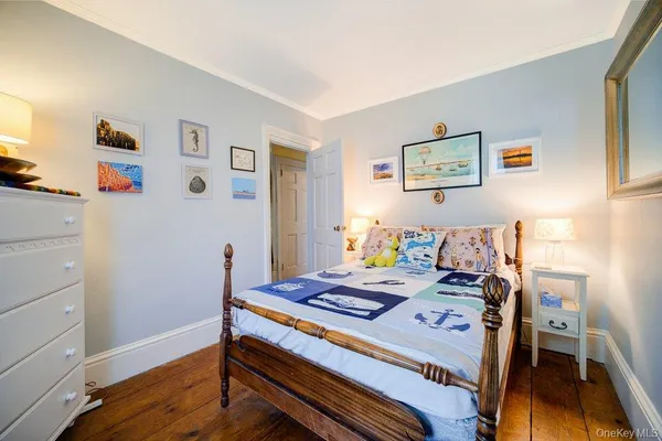 a bedroom with a bed and a table in it