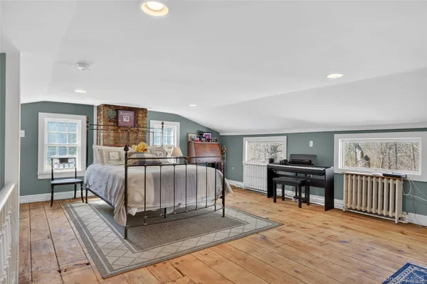 a bedroom with a bed and a desk