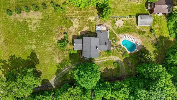 an aerial view of a house with a garden