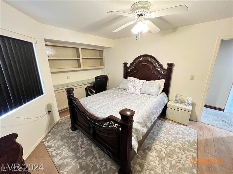 9436 Quail Ridge Drive Las Vegas, NV 89134 - Photo 15 of 17 Bedroom with wood finished floors and ceiling fan