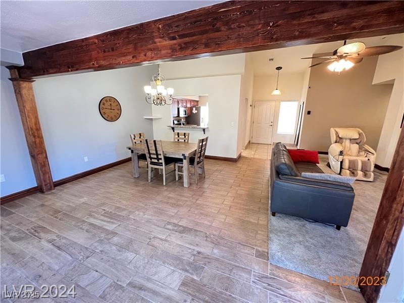 9436 Quail Ridge Drive Las Vegas, NV 89134 - Photo 5 of 17 Dining space featuring a chandelier and ceiling fan