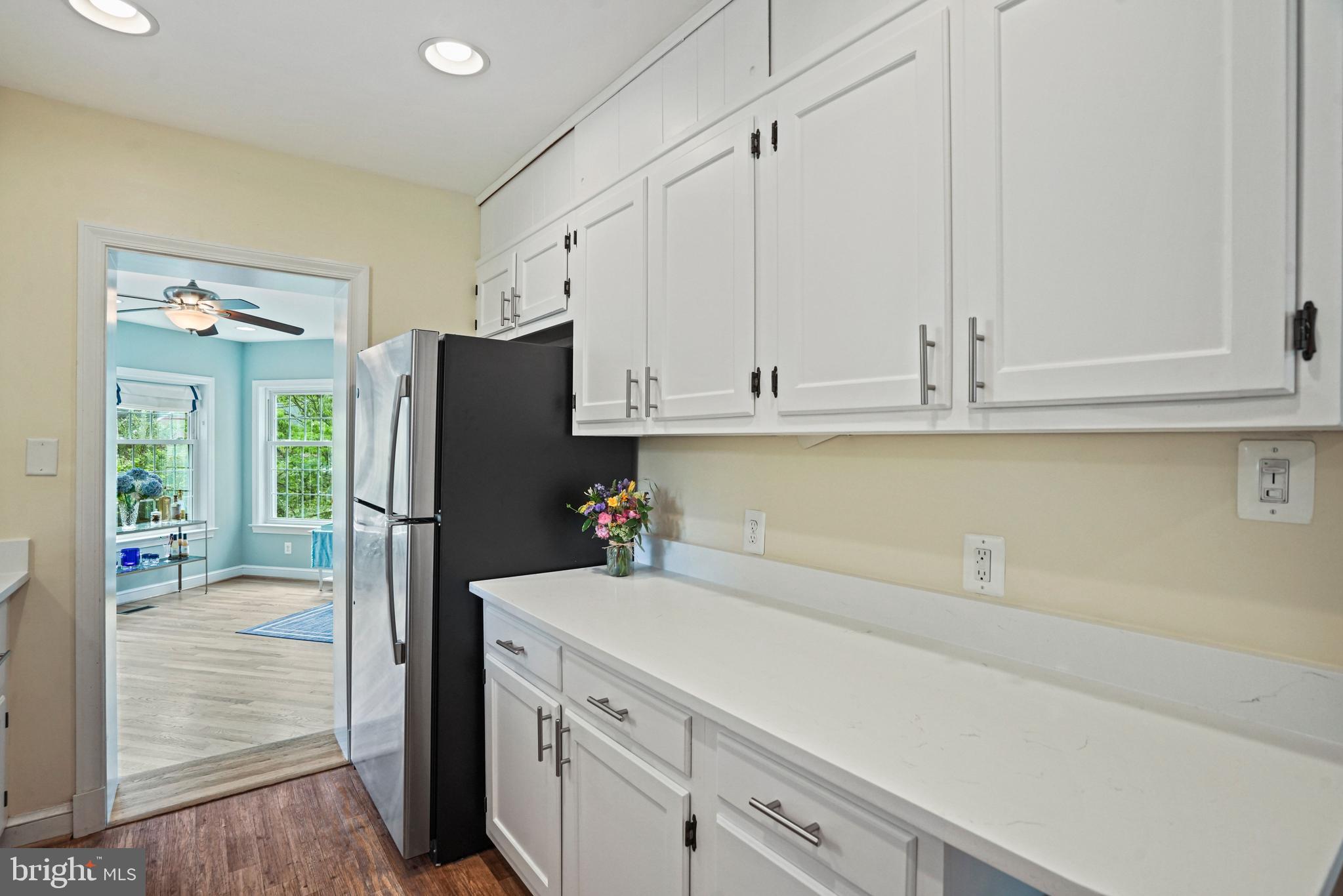 1907 Brisbane Street Silver Spring, MD 20902 - Photo 12 of 39 a kitchen with a refrigerator and cabinets