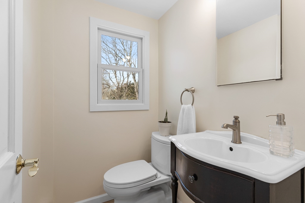 1 Maureen Road Lexington, MA 02420 - Photo 23 of 40 a bathroom with a toilet sink and mirror