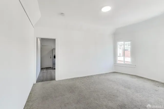 an empty room with a bathroom