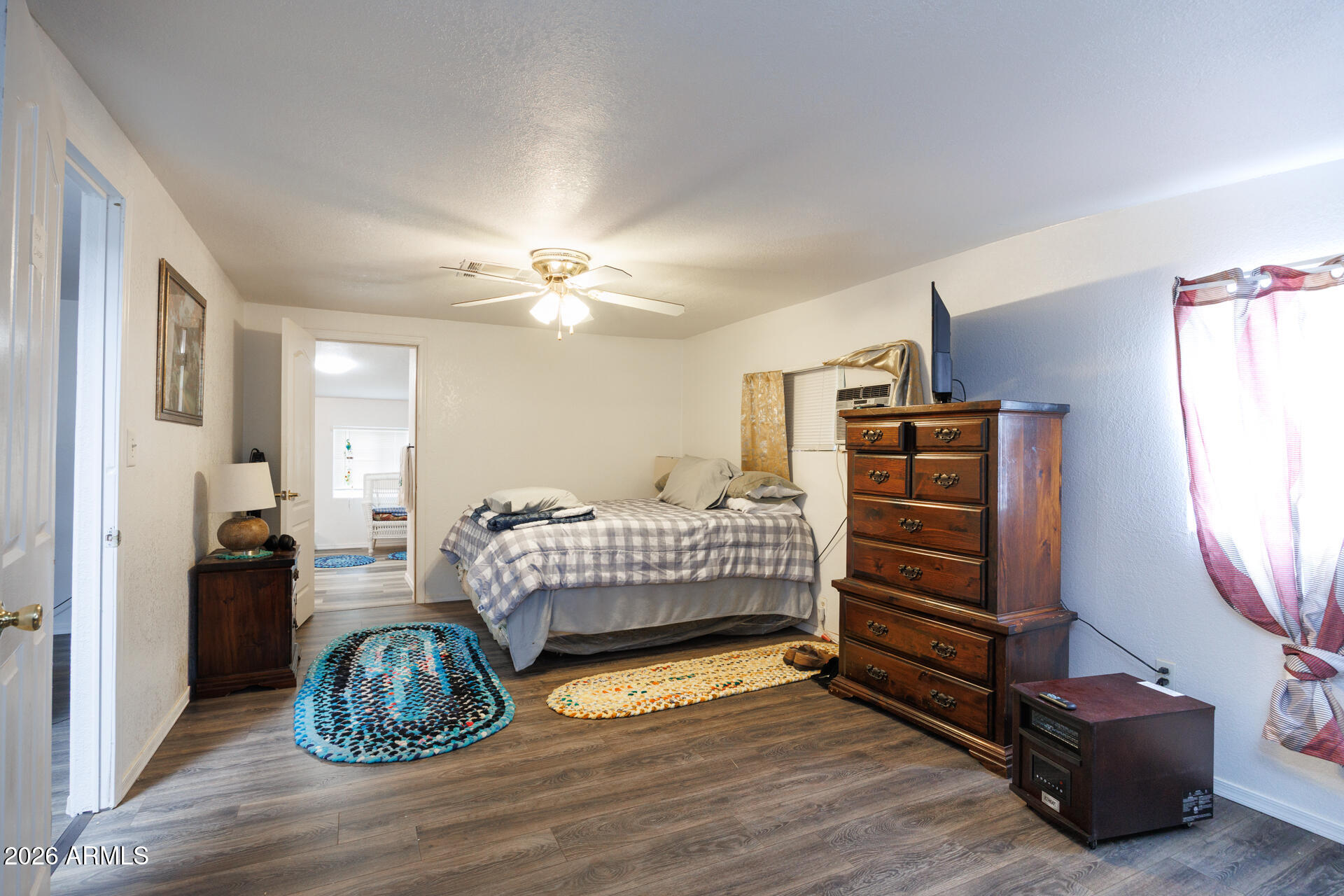 6185 East Monitor Street Picacho, AZ 85141 - Photo 51 of 55 a bedroom with a bed and a chandelier