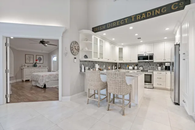 a kitchen with stainless steel appliances granite countertop a stove and a sink