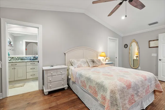 a bathroom with a granite countertop sink a large mirror and a window