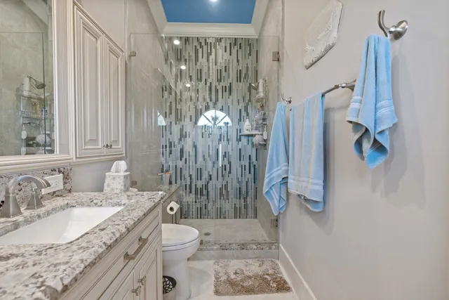 a bedroom with a bed a desk and chair