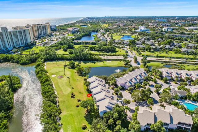 an aerial view of residential houses with outdoor space and street view