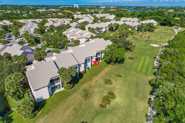 an aerial view of a house with yard swimming pool and outdoor seating