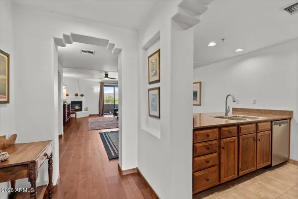 a spacious bathroom with a double vanity sink and a mirror