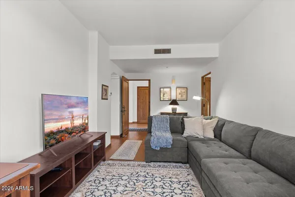 a living room with furniture and a flat screen tv