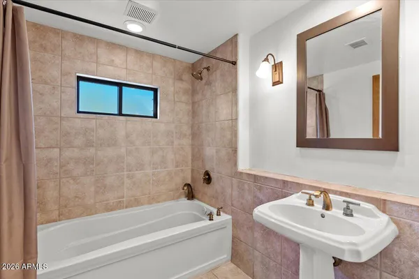 a bathroom with a sink and a bathtub