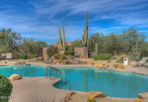 a view of a backyard with sitting area