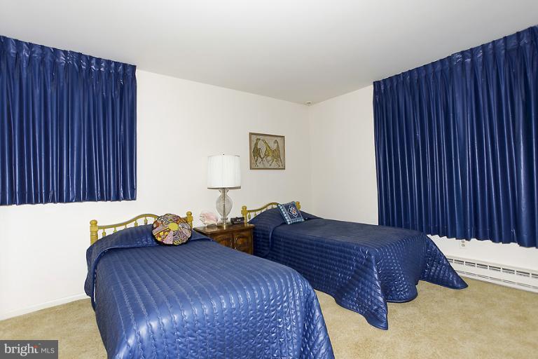 16215 Comus Road Clarksburg, MD 20871 - Photo 16 of 29 a bedroom with a bed and a dresser
