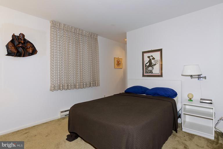 16215 Comus Road Clarksburg, MD 20871 - Photo 18 of 29 a bedroom with a bed and painting on the wall