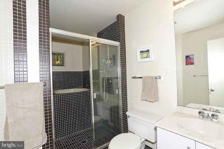 16215 Comus Road Clarksburg, MD 20871 - Photo 24 of 29 a bathroom with a sink toilet and shower
