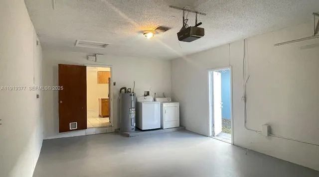 a view of storage and utility room with washer and dryer