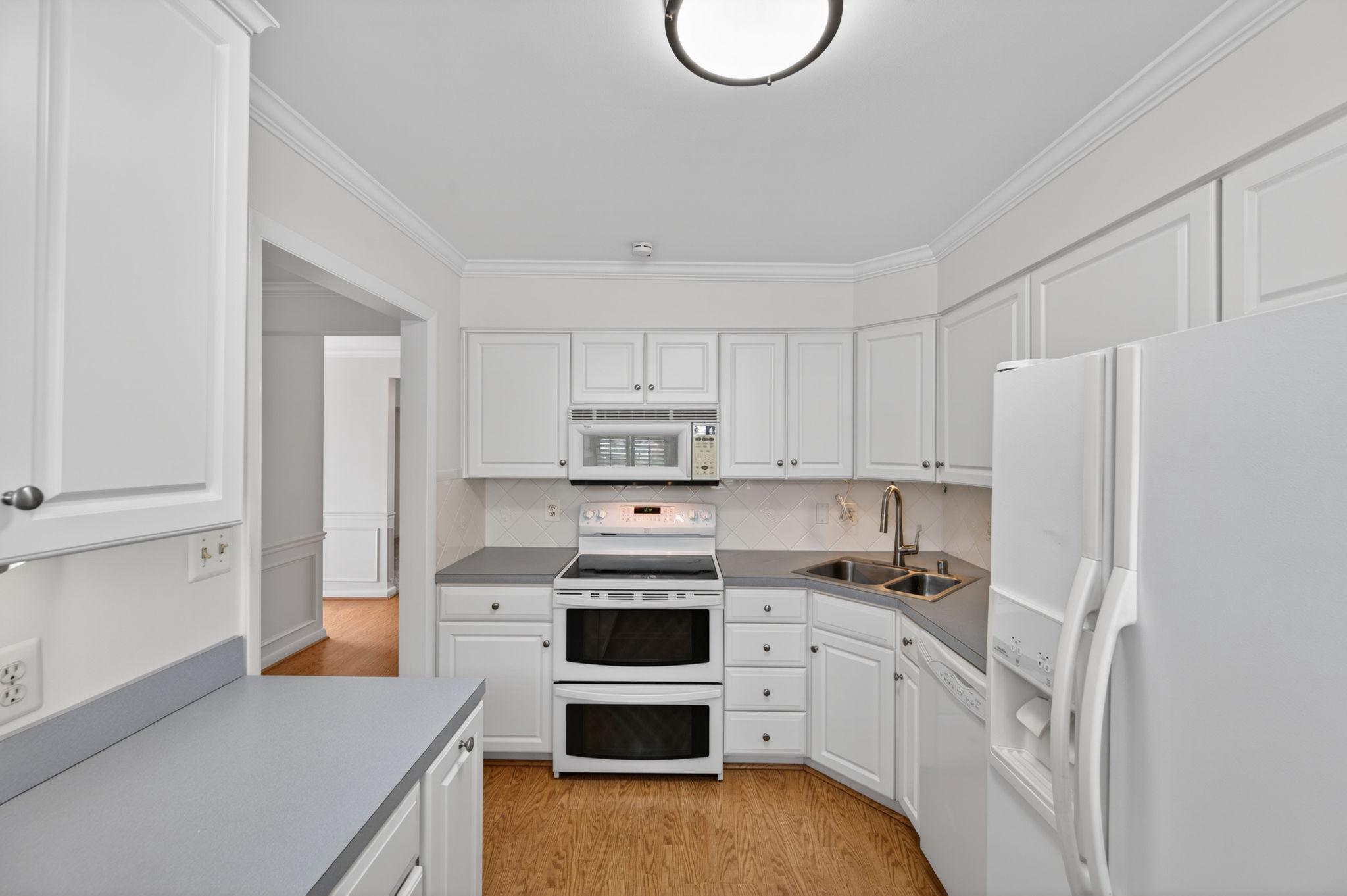 45 Old Sound Road Joppa, MD 21085 - Photo 26 of 62 Bright white cabinetry and appliances.