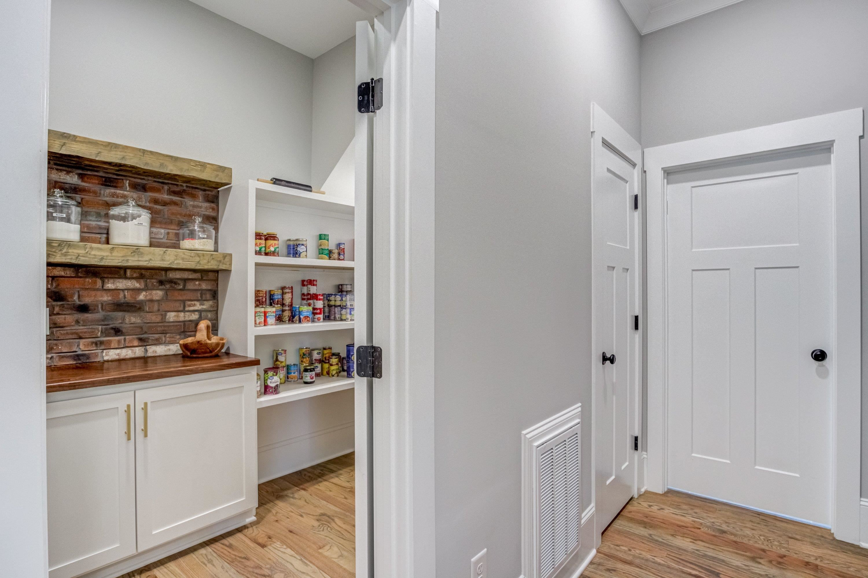 109 Independence Drive Smithfield, NC 27577 - Photo 13 of 36 a kitchen with a sink and wooden floor