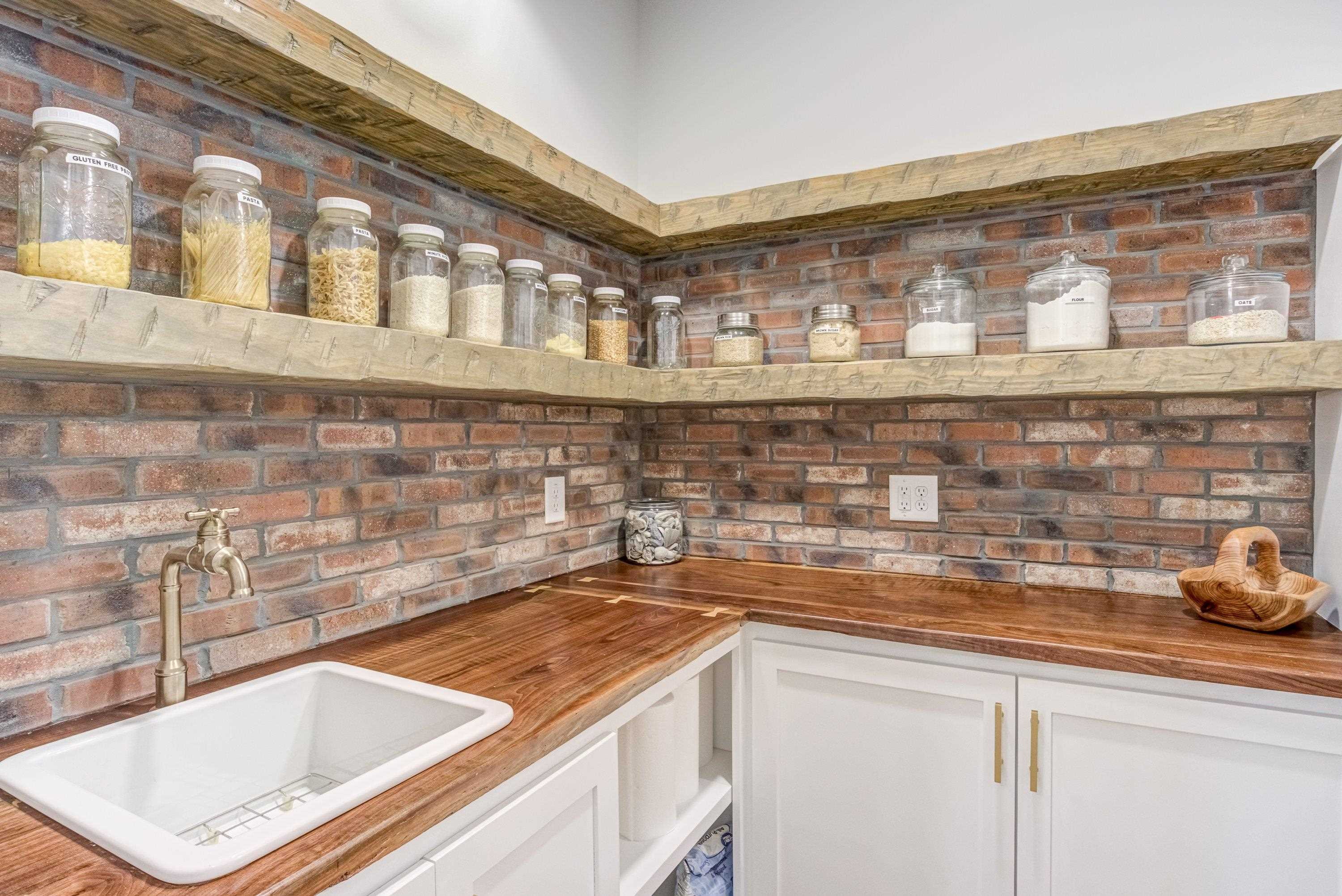 109 Independence Drive Smithfield, NC 27577 - Photo 14 of 36 a kitchen with a sink and cabinets