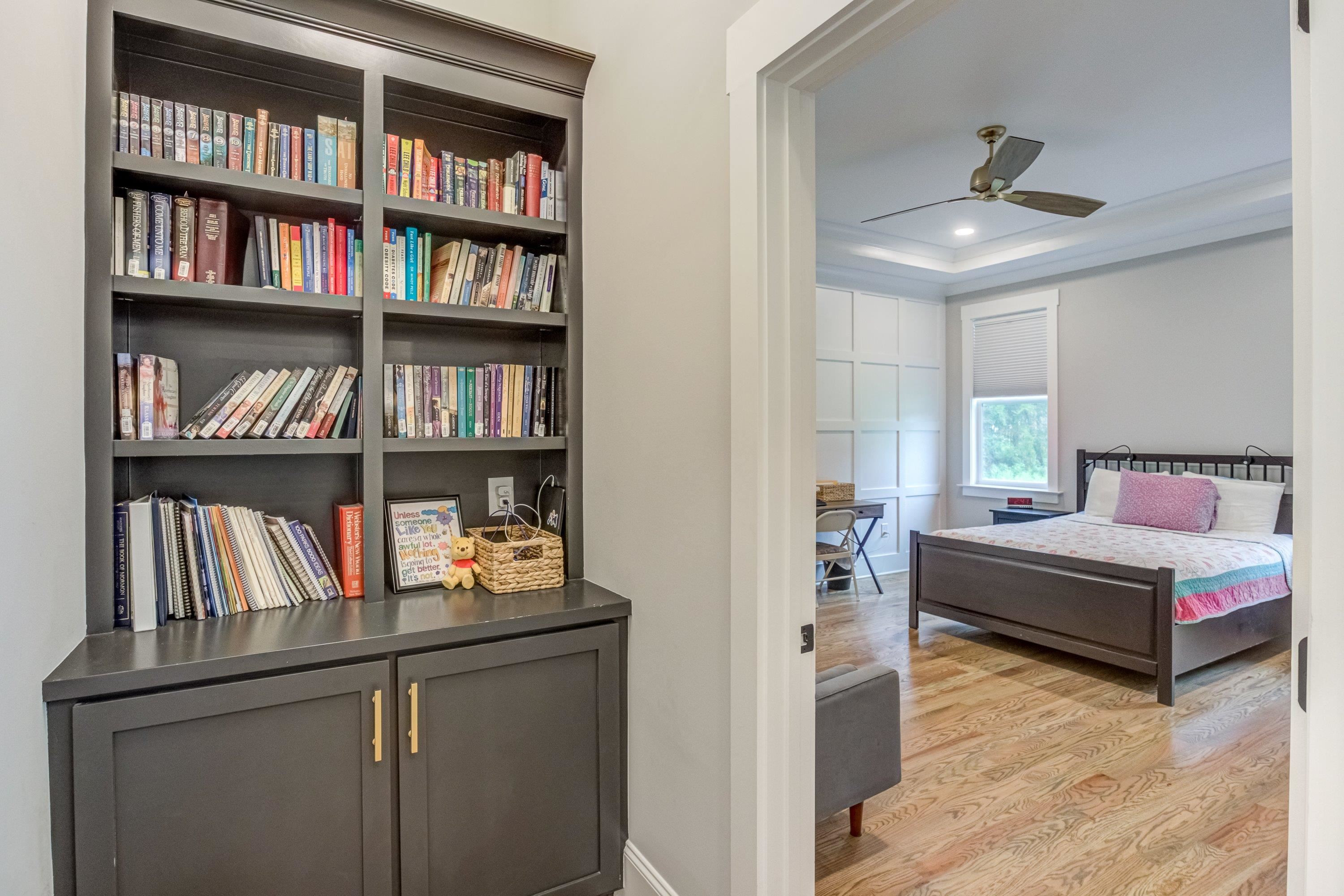 109 Independence Drive Smithfield, NC 27577 - Photo 16 of 36 a bedroom with a bed furniture and a book shelf