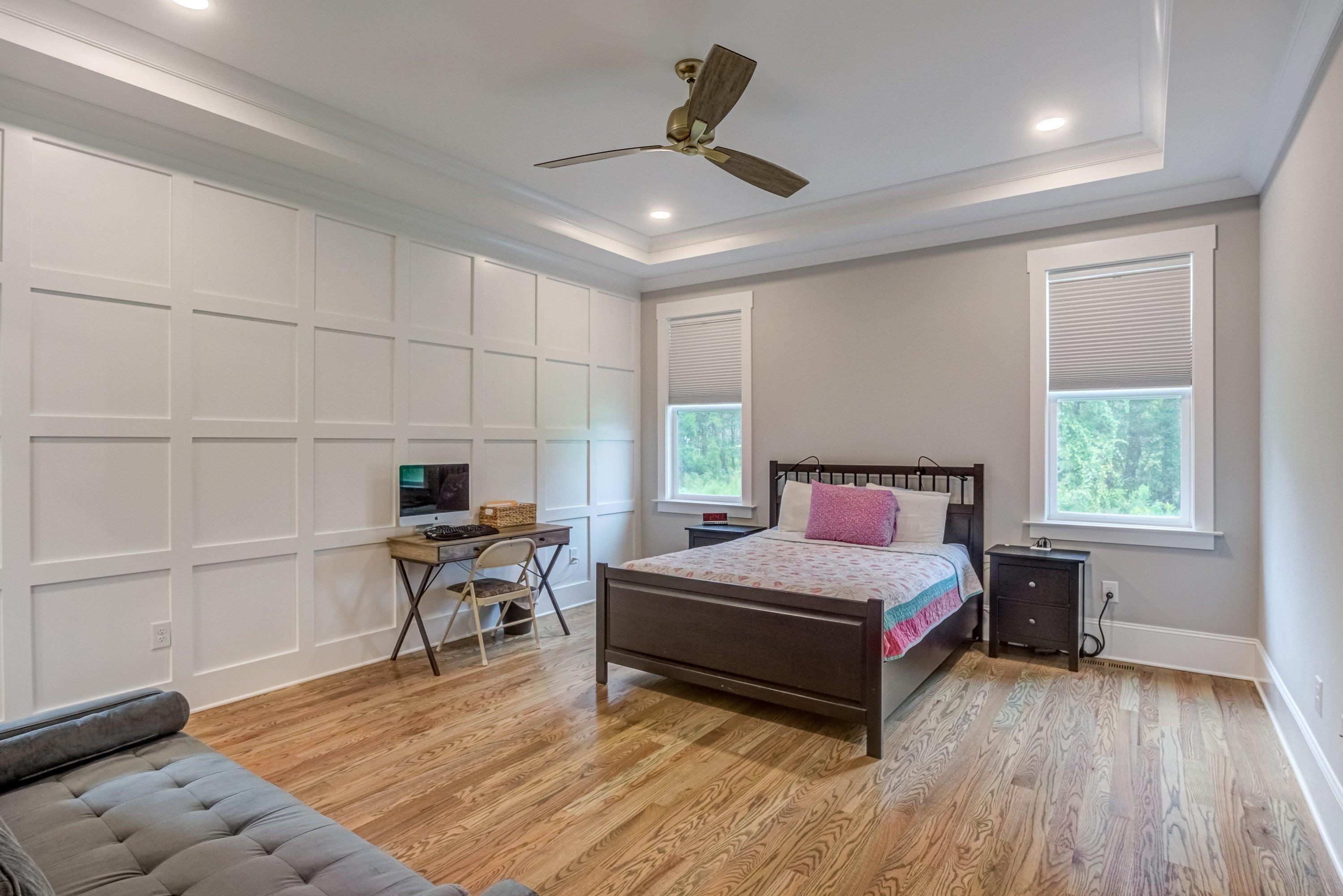 109 Independence Drive Smithfield, NC 27577 - Photo 17 of 36 a bedroom with a bed and a chair