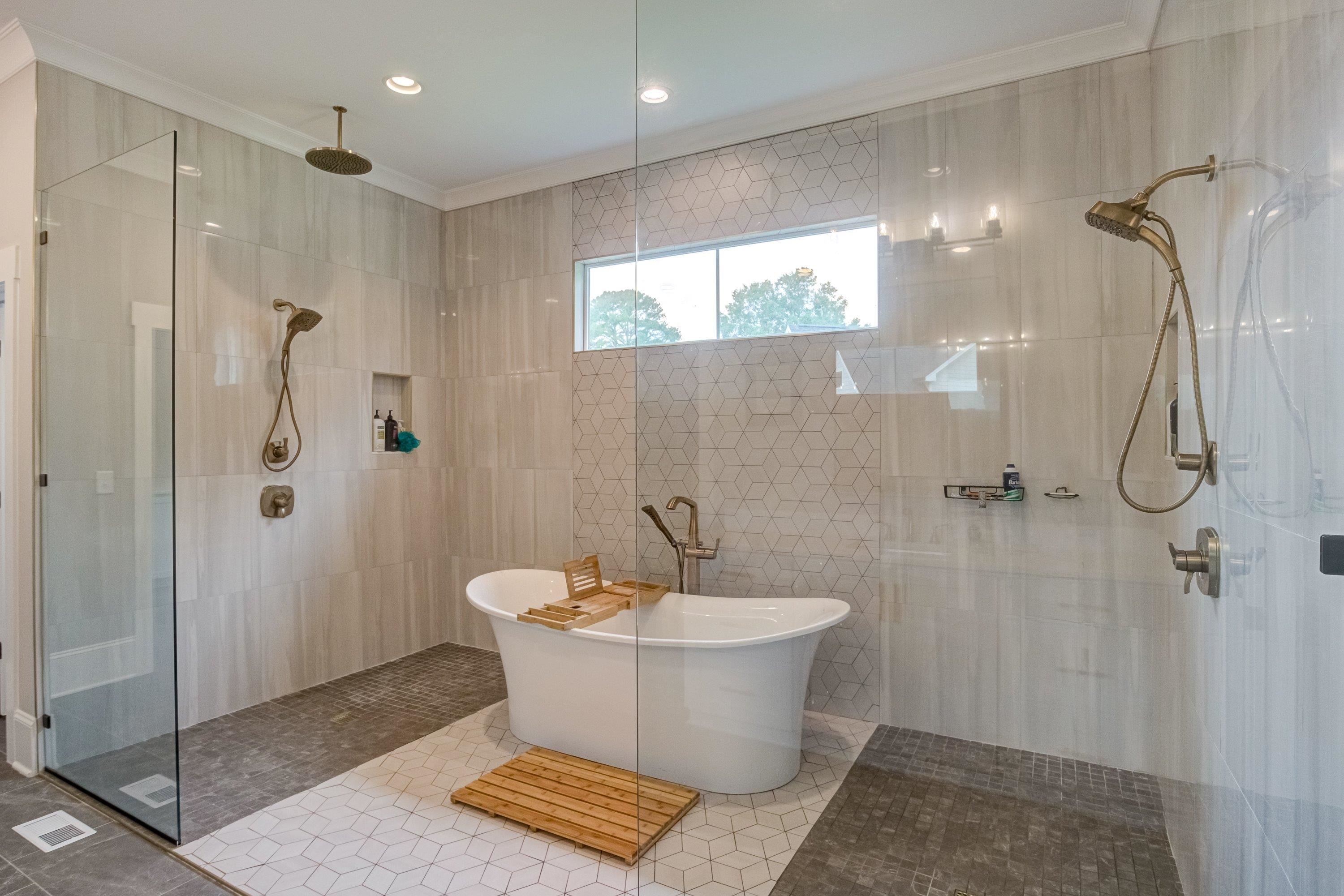 109 Independence Drive Smithfield, NC 27577 - Photo 19 of 36 a bathroom with a bathtub and shower