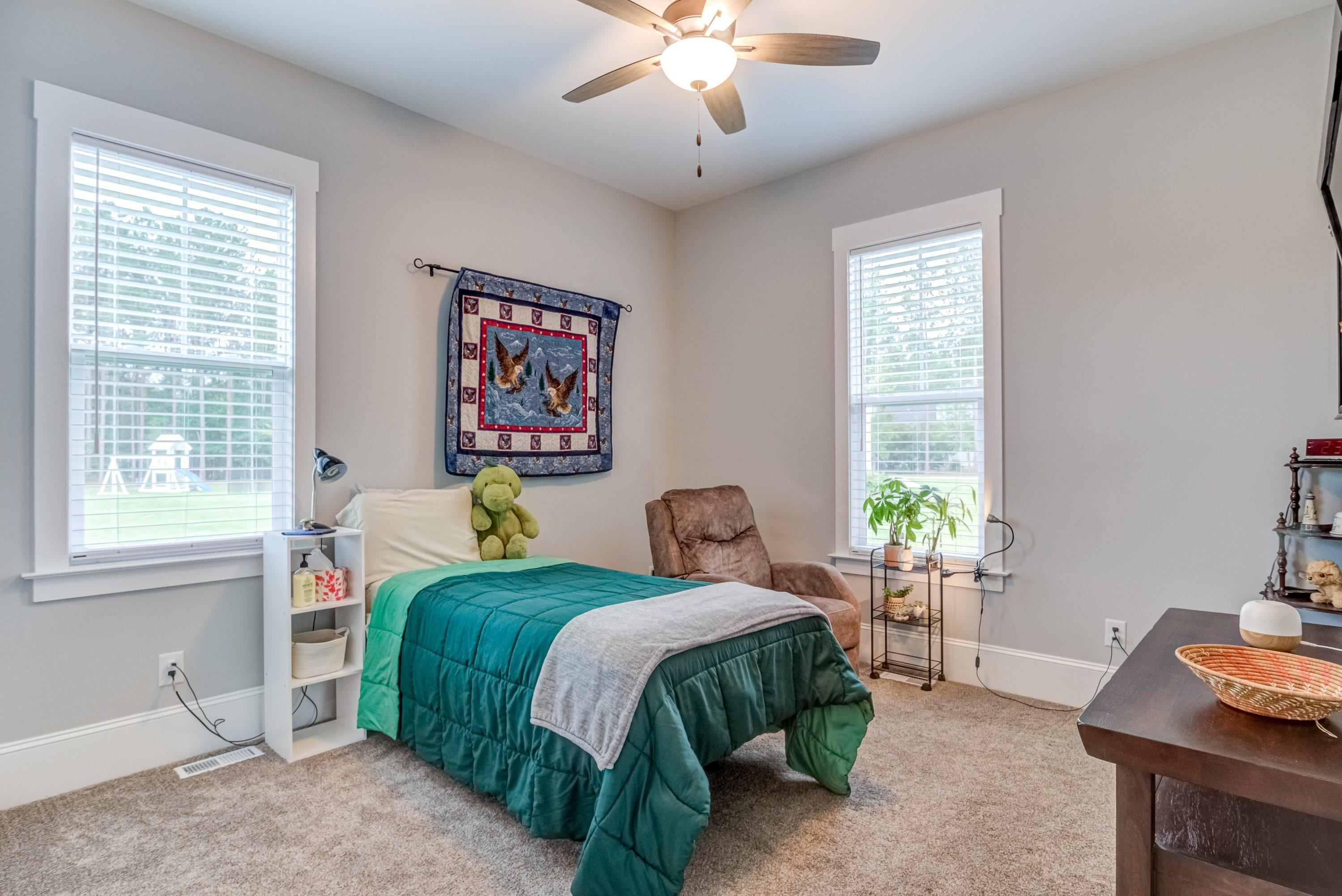 109 Independence Drive Smithfield, NC 27577 - Photo 21 of 36 a bedroom with a bed and a table