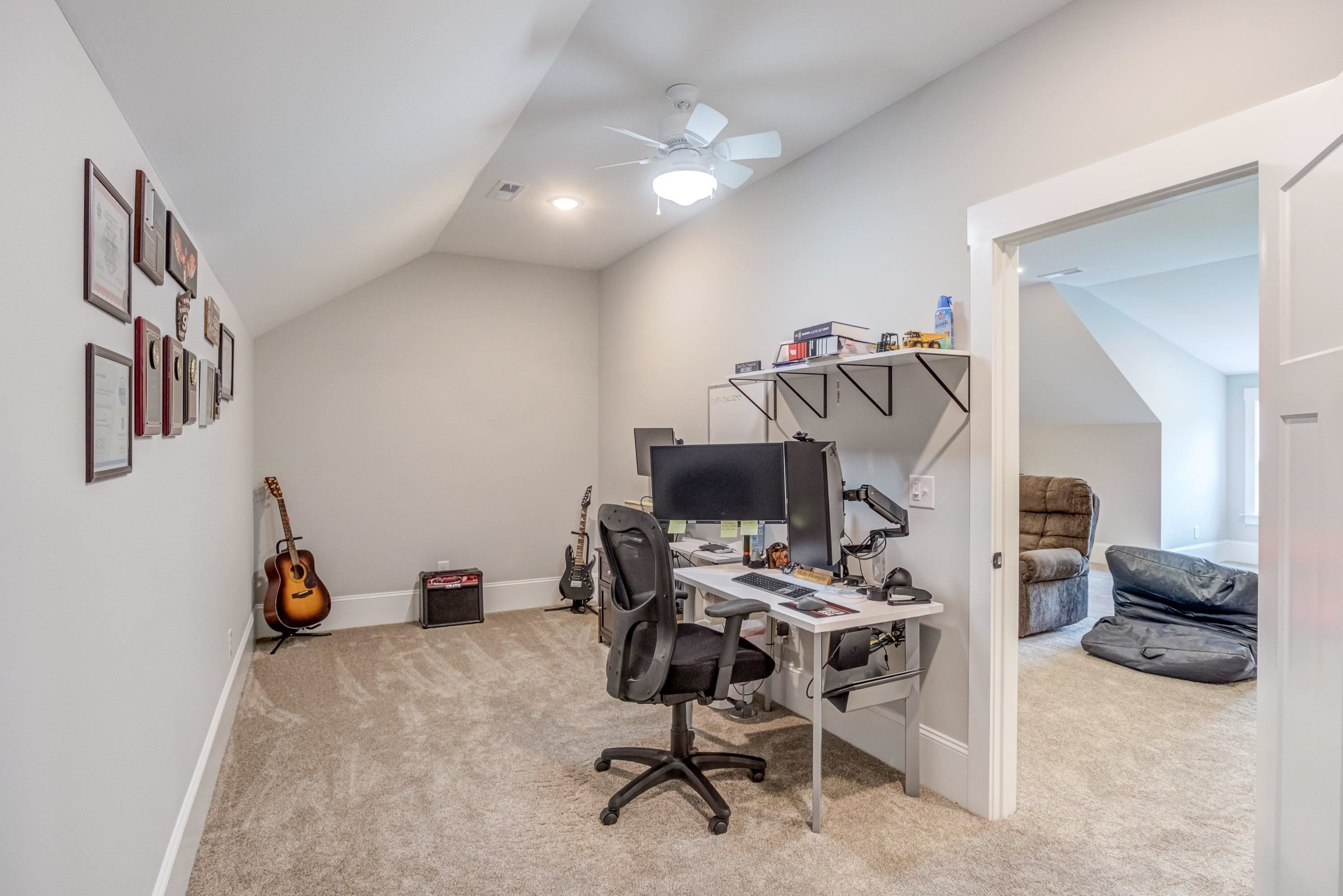 109 Independence Drive Smithfield, NC 27577 - Photo 25 of 36 a workspace with furniture and a fan