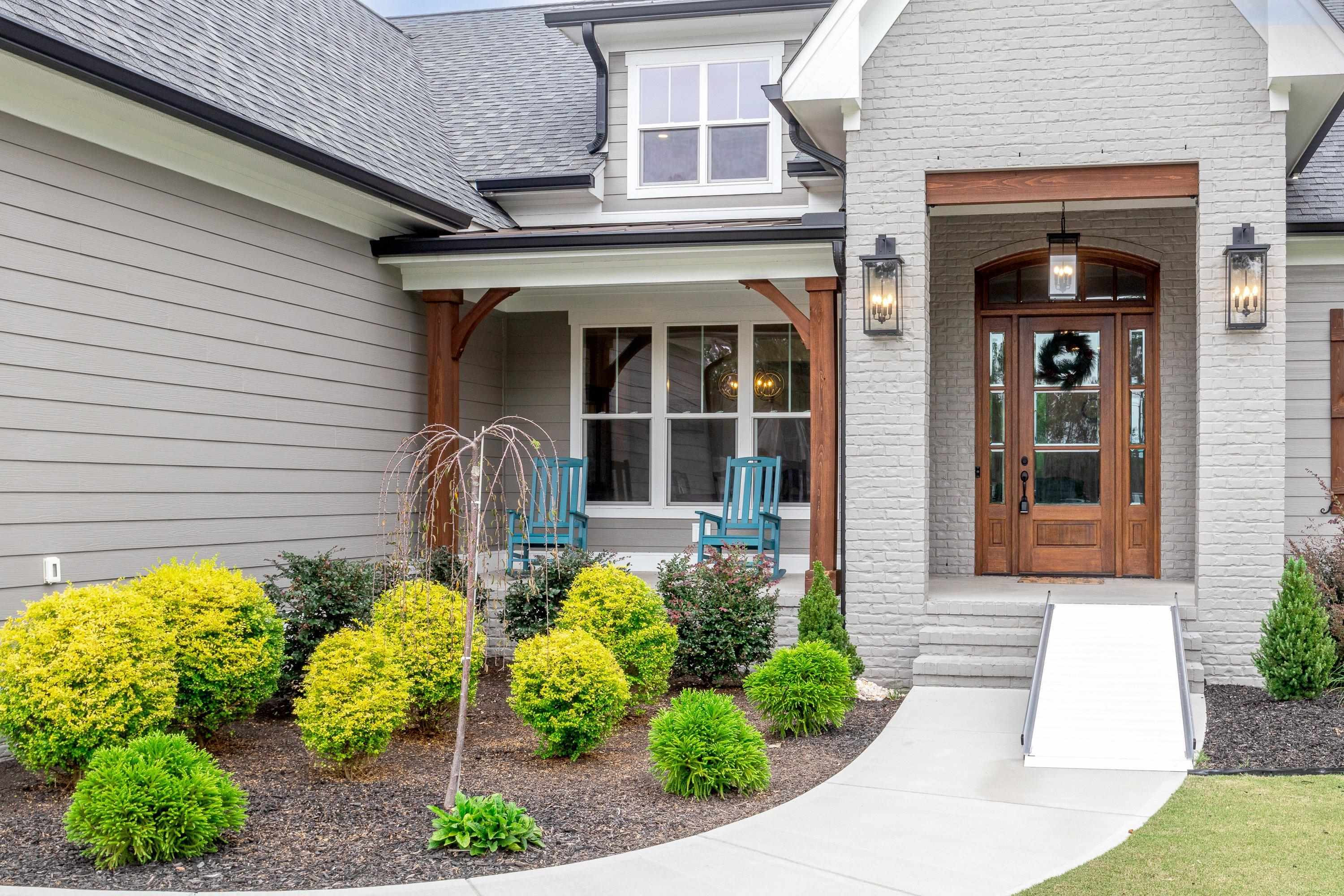 109 Independence Drive Smithfield, NC 27577 - Photo 3 of 36 a front view of a house with garden