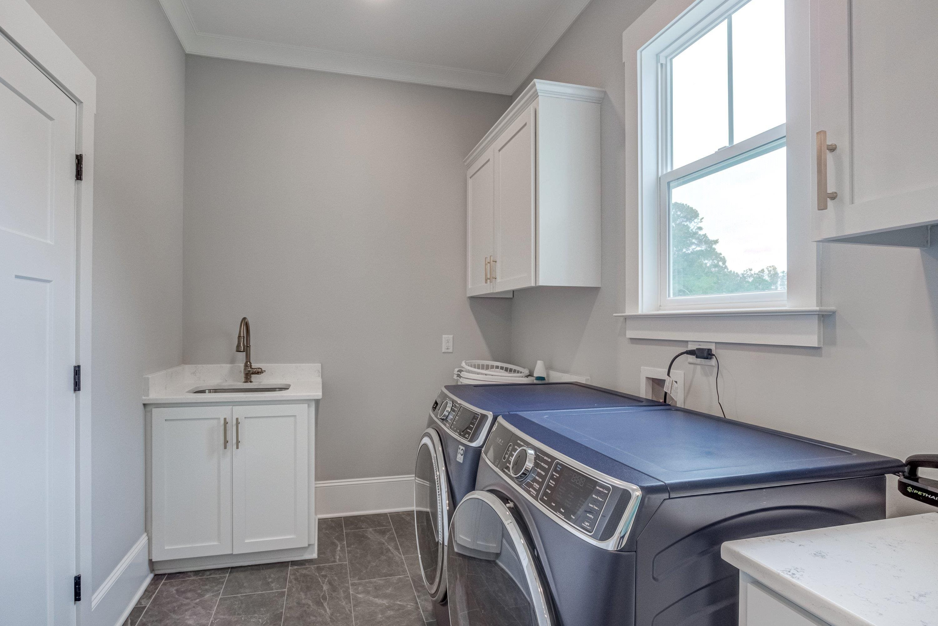 109 Independence Drive Smithfield, NC 27577 - Photo 31 of 36 a view of a kitchen with a sink dishwasher and a window