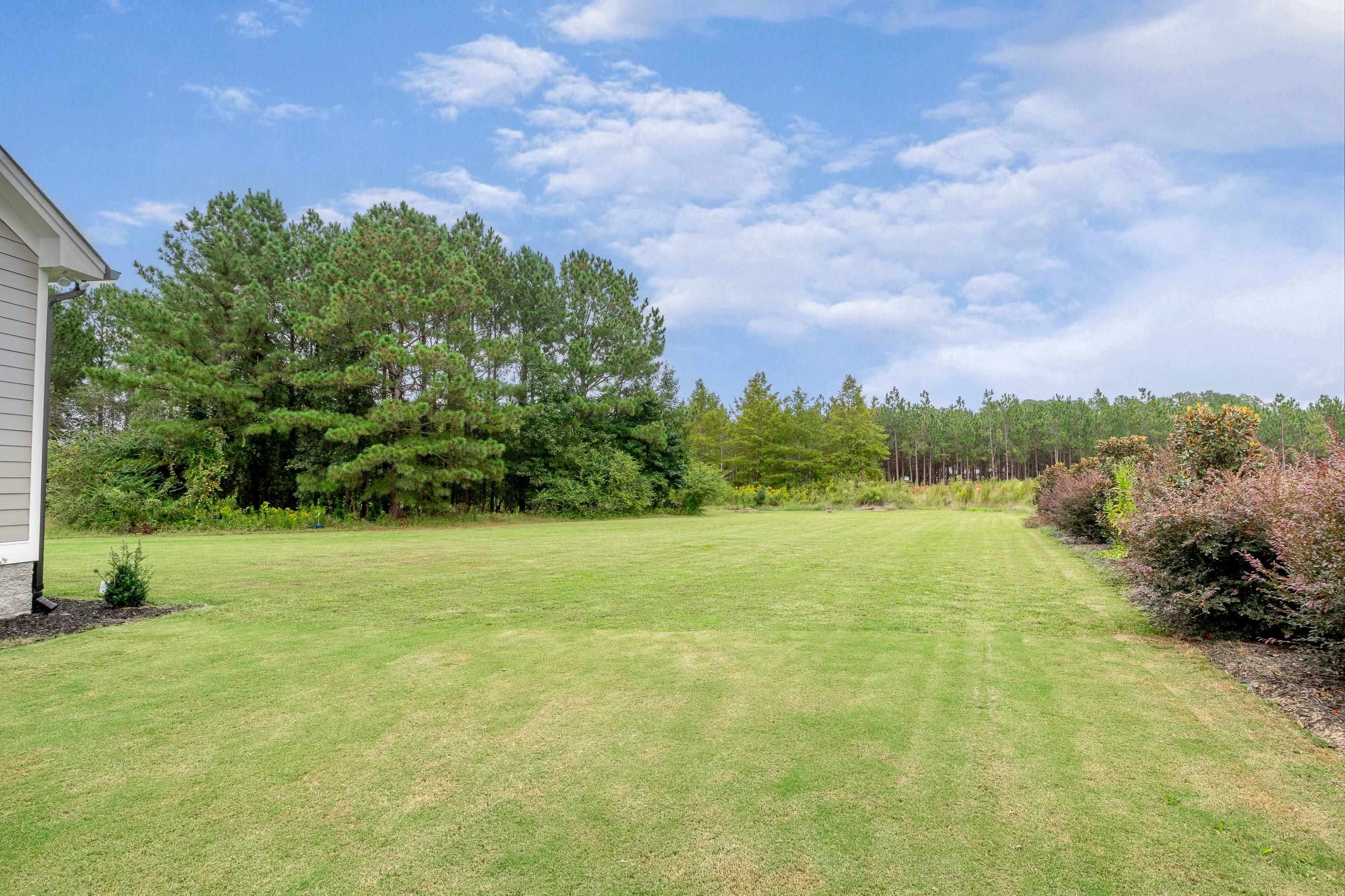 109 Independence Drive Smithfield, NC 27577 - Photo 34 of 36 a view of a lake with a yard