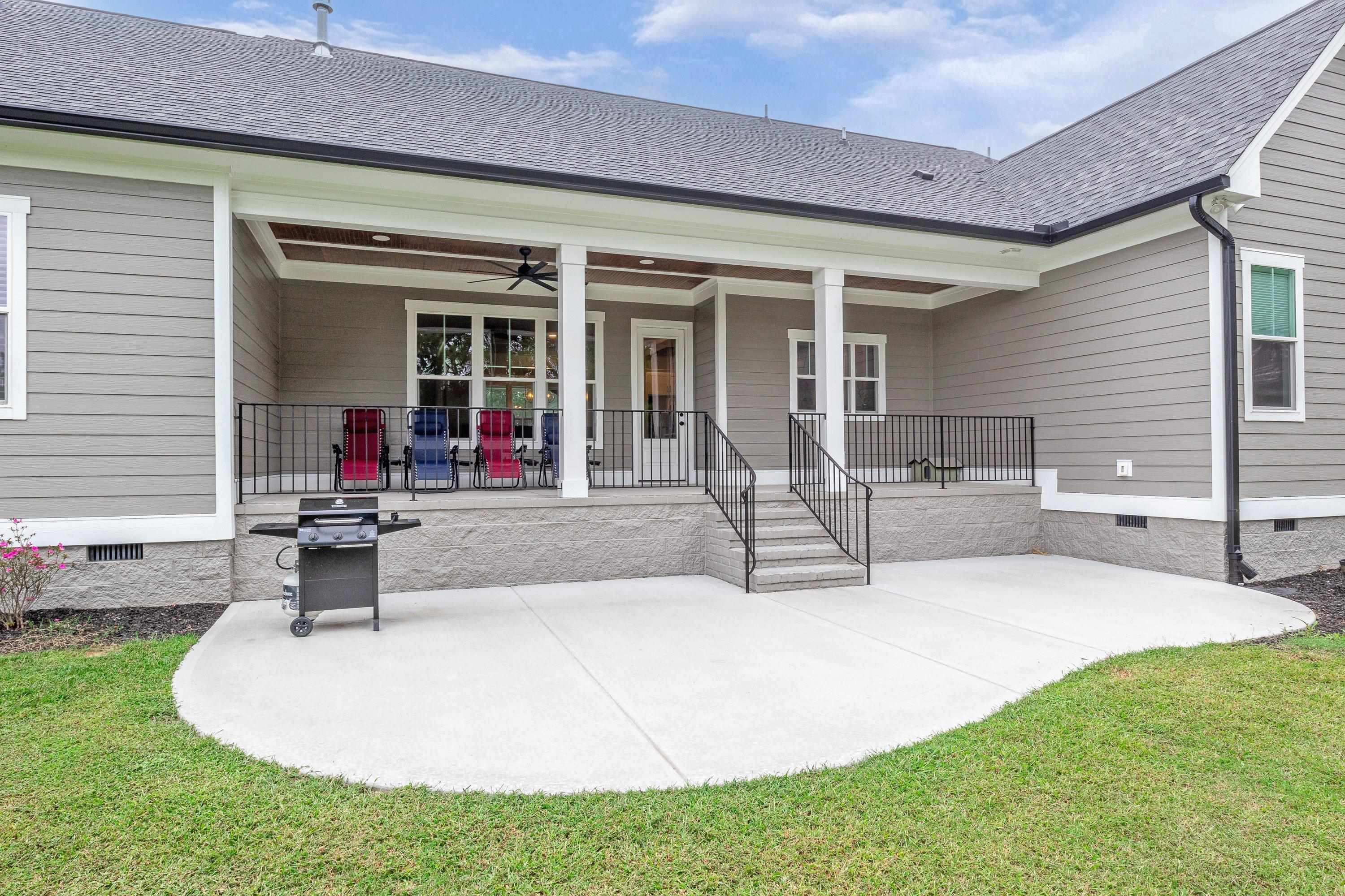 109 Independence Drive Smithfield, NC 27577 - Photo 35 of 36 a front view of a house with sitting area and garden
