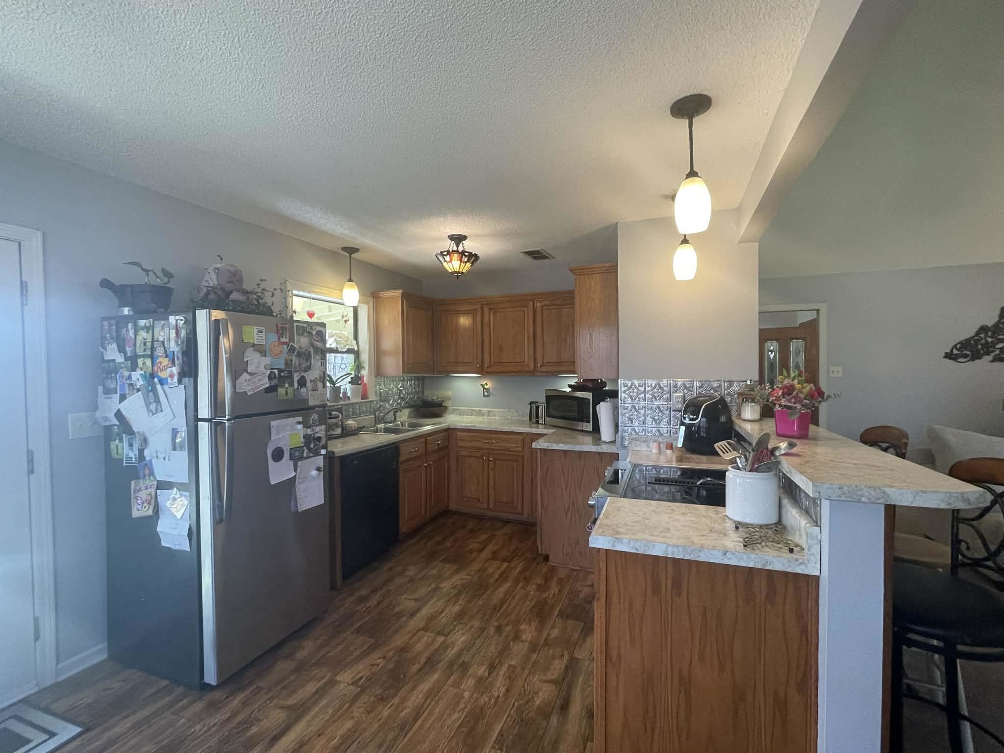 1655 Country Club Road Somerville, TN 38068 - Photo 14 of 26 a kitchen with refrigerator and cabinets